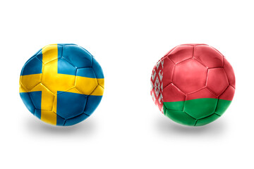 Fototapeta premium football balls with national flags of belarus and sweden,soccer teams. on the white background.