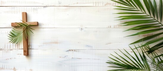 Cross and palm on wooden white background easter sign symbol concept. Copy space image. Place for adding text or design