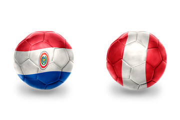 football balls with national flags of peru and paraguay , soccer teams. on the white background.
