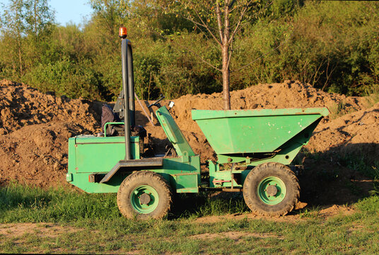 Heavily used strong robust forward rotary tipping dumper with powerful engine coupled with no compromise four wheel drive used in most demanding conditions and skip that can be rotated through 180 deg