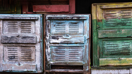 Old beehives with signs of dilapidation, reused materials and sustainable practices in beekeeping. Zero Waste, new uses for old objects, reducing reliance on new resources. Banner with copy space