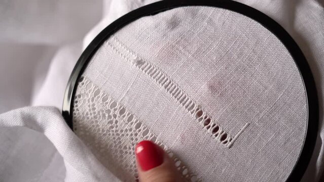 Embroidery Stitches for a Lace Design on White Fabric. Process of creating traditional Ukrainian embroidery