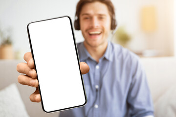 Cool Music App. Man Gesturing Thumbs-Up Listening To Song Or Podcast Via Wireless Headphones At...