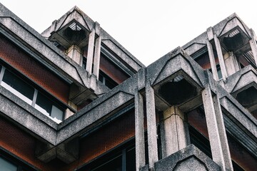 Close-up of a brutalist architecture building with concrete and brick materials.