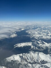 Obraz premium Aerial view of the Canadian Rockies taken from above in an airplane