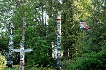 Colorful totem poles standing tall in Stanley Park, Vancouver