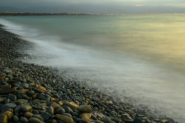 Very beautiful mediterranean seascape with setting sun on sunset. Waves crash on rocks in nature. 3
