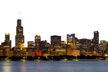 Chicago skyline at dusk, featuring illuminated buildings against a twilight sky, shot from a distance with water in the foreground