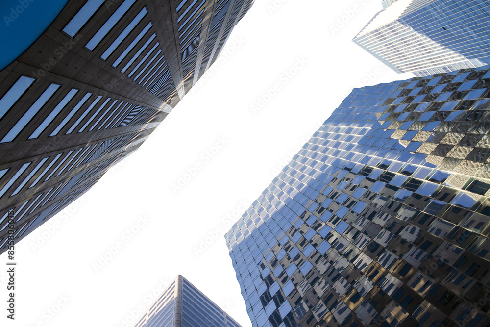 Poster upward view of modern skyscrapers against a clear sky, showcasing architectural design and perspecti