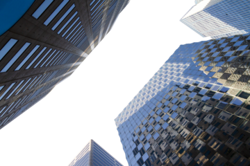 Upward view of modern skyscrapers against a clear sky, showcasing architectural design and perspective