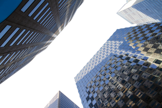 Upward view of modern skyscrapers against a clear sky, showcasing architectural design and perspective