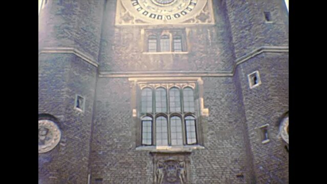 Molesey, UNITED KINGDOM - CIRCA 1970: Anne Boleyn's Gate of Hampton Court Palace. The Tudor gatehouse and astronomical clock. East Molesey beside London city. Archival in 1970s in England.