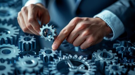 A close-up shot of a person's hand holding a gear, representing the concept of hands-on work, problem-solving, and the intricate details of machinery