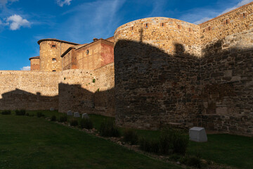 Fototapeta premium Roman stone walls of the city of Leon and the old prison in the background in a sunny day.