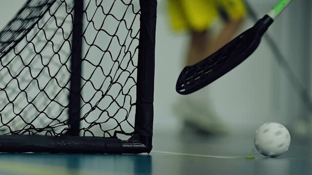 Close-up of a Floorball getting into the Gates. Floor Hockey
