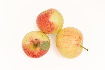 Top view of red apples on a white background