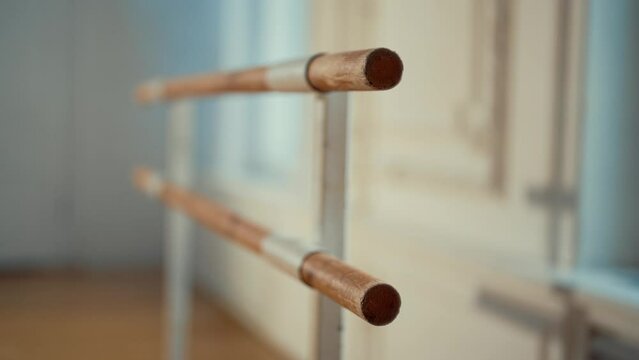 Barre in ballet hall, closeup view, equipment for professional dancers. Training and exercising with barre in empty rehearsal hall, ballet class without people, traditional dance art and interior