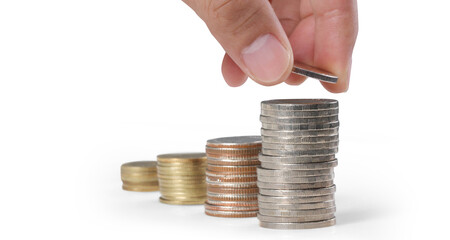 Hand laying coins on stacks coins in  row ,Business idea