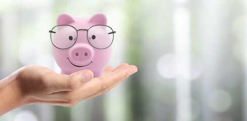 Hands and coins in savings jar, piggy bank, money saving, Business idea