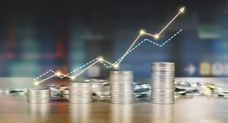 Stack of coin with trading graph, financial investment concept