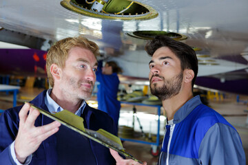 an aeronautic technicians doing inspection