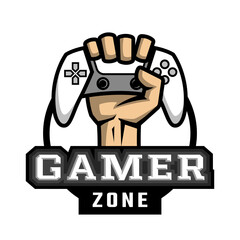 The hand holds the controller. Hardcore gamer logo.