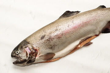 Fish red river trout, cleaning the scales, home cooking