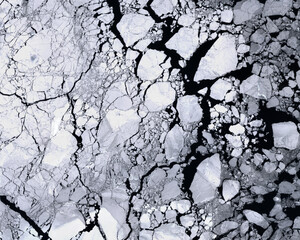 Texture of ice with cracks seen from space.  Elements of this satellite image furnished by Copernicus.
