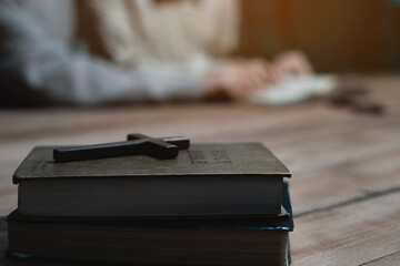 Asian men and women hands praying to god with the bible. Pray for god blessing. Religious beliefs Christian life crisis prayer to god.