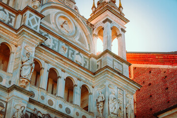 Bell tower of the Charterhouse of Pavia (Certosa di Pavia) with sun glow