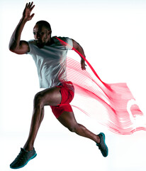Full-length dynamic image of muscular, athletic man in motion, running, training isolated on...