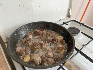 Dirty gas stove cooking oil stains on gas stove when when frying food.