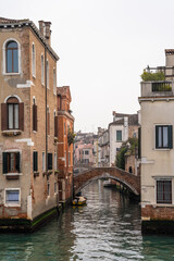 Scenic canal with bridge and ancient buildings. Houses with beautiful facade in Venice, Italy 04.01.2024