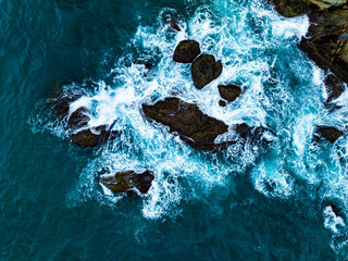 Amazing seascape view seashore and big waves crashing on rocks, Aerial view waves sea surface in Phuket island Thailand,Travel and business tour website background concept