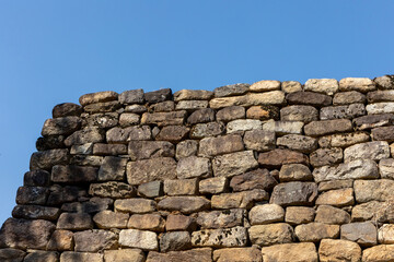 stone wall with blue sky background