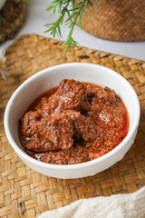 Rendang Daging, a Malaysian traditional dish featuring tender meat cooked in coconut milk and a blend of aromatic spices.