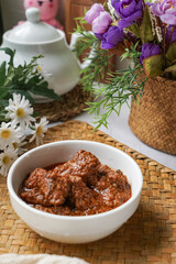 Rendang Daging, a Malaysian traditional dish featuring tender meat cooked in coconut milk and a blend of aromatic spices.