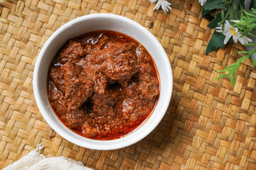Rendang Daging, a Malaysian traditional dish featuring tender meat cooked in coconut milk and a blend of aromatic spices.