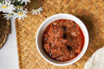 Rendang Daging, a Malaysian traditional dish featuring tender meat cooked in coconut milk and a blend of aromatic spices.