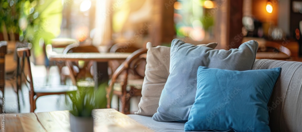 Poster beautiful pillow on sofa in coffee shop. copy space image. place for adding text and design