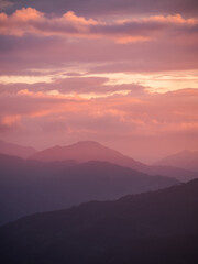 Beautiful misty mountain forest in sunset time