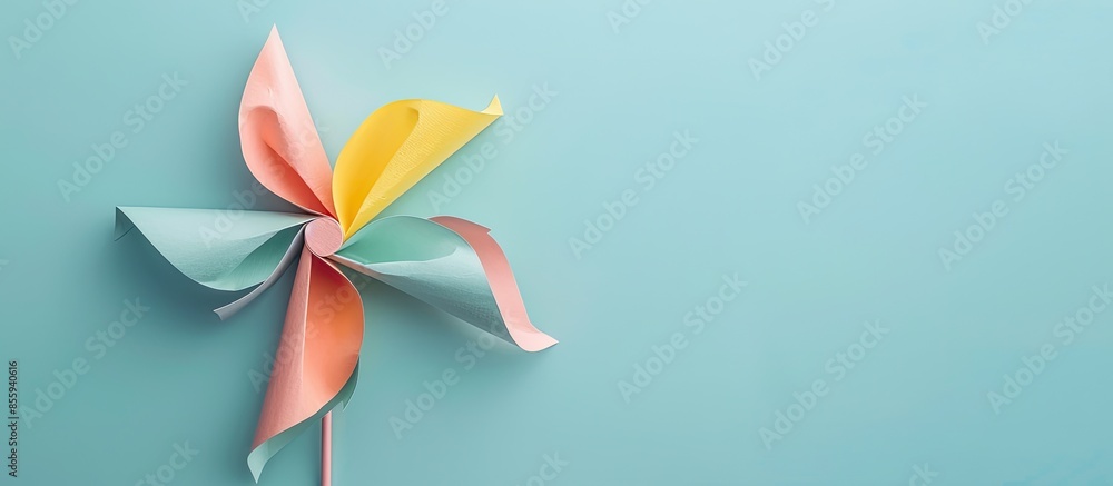 Poster toy pinwheel on pastel background paper pinwheel toy. copy space image. place for adding text and de