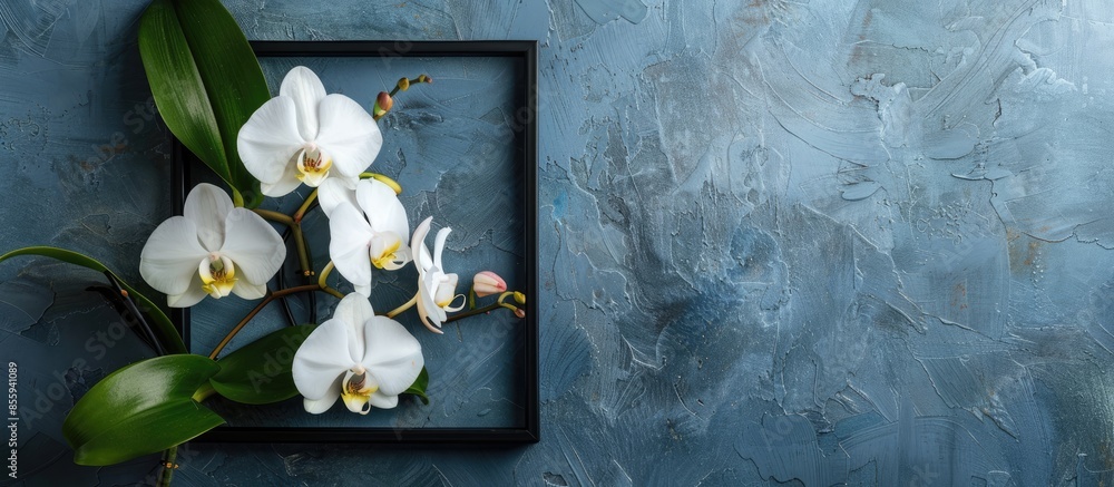 Poster square frame mockup with white orchid flower over grey wall. copy space image. place for adding text