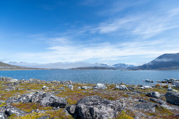 Greenland Nanortalik north sea landscape seascape marina surrounded by fjord mountain peaks on a sunny day