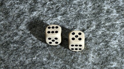 A pair of dice thrown with the number eleven. 11 and Doubles is a game with dice