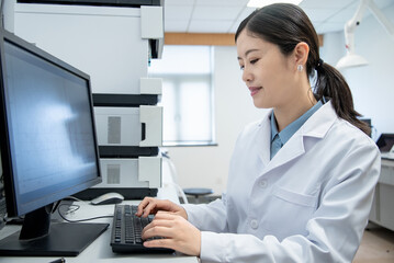 doctor working on computer in lab