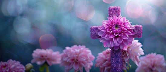 Christian cross made of dahlias beautigul purple flowers. First communion cross. Cross for Christian, Baptism,Easter invitations. Copy space image. Place for adding text or design