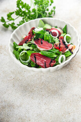 salad duck breast meat smoked duck magret fresh meal food snack on the table copy space food background rustic