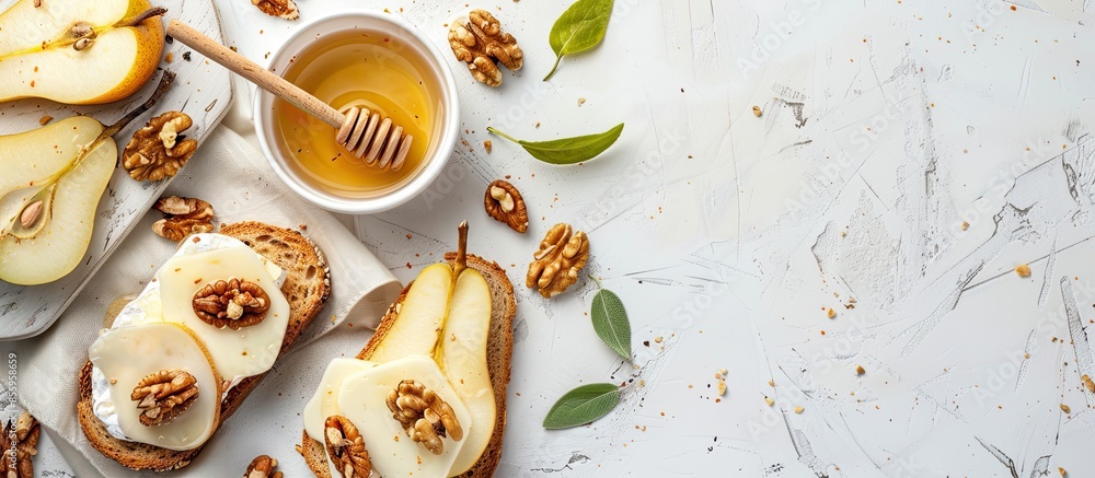 Aufkleber toast with cheese, pear, honey and nuts. delicious breakfast or snack on a light background, top vie
