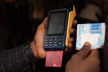 Point of sale pos machine and Nigerian banknotes cash